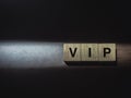 VIP concept on wooden blocks.