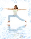 Virabhadrasana warrior pose on white sand Royalty Free Stock Photo