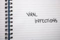 Viral infections handwriting  text on paper, on office agenda. Copy space Royalty Free Stock Photo