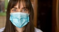 Viral mask European woman self-isolation wearing face protection in theprevention of coronavirus Royalty Free Stock Photo