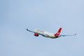 A Virgin Atlantic Airbus A330-300 flies against a bright blue sky