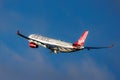 A Virgin Atlantic Airbus A330-300 flies against a bright blue sky
