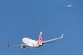 Virgin Australia Airlines Boeing 737 airliner taking off from Sydney Airport with a Qantas A330 in the background