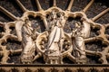 The Virgin with Child statue on the west facade of Notre Dame Cathedral in the golden autumn sunlight Royalty Free Stock Photo