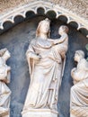 Virgin and Child with two Angels, Portal on the side-wall of Florence Cathedral Royalty Free Stock Photo