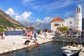 Virgin island on the reef. View of the Church, Perast and Boko-Kotor Bay. Montenegro