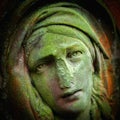 Virgin Mary. Ancient stone statue of sad woman in grief Royalty Free Stock Photo