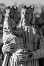 Virgin Mary with the baby Jesus Christ. Religion, faith, eternal life, God concept. Close up ancient statue. Black and white image Royalty Free Stock Photo