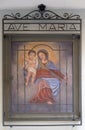 Virgin Mary with baby Jesus, house facade in Lugano