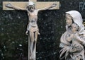 Virgin Mary with baby Jesus looks at Jesus crucified on the cross, Cemetery in Hohenberg, Germany Royalty Free Stock Photo