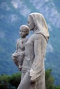 Virgin Mary with baby Jesus statue in front of the Cathedral of Saint Lawrence in Lugano Royalty Free Stock Photo