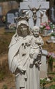 Virgin Mary and Child Jesus in a cemetery Royalty Free Stock Photo