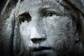 Virgin Mary. Fragment of very ancient stone statue. Religion, faith, suffering, love concept Royalty Free Stock Photo