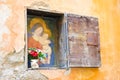 Virgin Mary with Jesus Christ in a niche in the wall Royalty Free Stock Photo