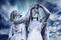 Virgin Mary Queen of Heaven blessed  among women. Very ancient stone statue. Selective focus on face and eyes Royalty Free Stock Photo