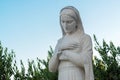 Virgin Mary statue in front of the Church of the Assumption of the Blessed Virgin Mary