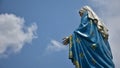 The Virgin Mary statue with moving clound on sky