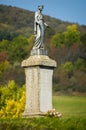 Virgin Mary statue on a pedestal