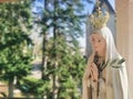 Virgin Mary statue praying with her hands joined ,with a crown. Our Lady of Fatima