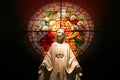 Virgin Mary statue with stained glass window Royalty Free Stock Photo