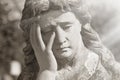 Virgin Mary statue. Vintage sculpture of sad woman in grief Rel Royalty Free Stock Photo