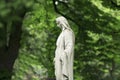 Virgin Mary statue. Vintage sculpture of sad woman in grief Rel Royalty Free Stock Photo