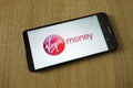 Virgin Money logo displayed on smartphone