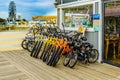 Virginia Beach Boardwalk, Virginia Beach US - September 12, 2017 Bicycle rental, candy shop and Ferris wheel on Boardwalk
