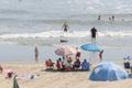 Sunbathers on the sand at Virginia Beach, VA.
