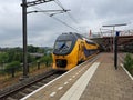 VIRM doubledeck intercity train along platform in Duivendrecht