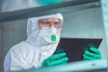 Virologist healthcare professional using tablet computer in laboratory Royalty Free Stock Photo
