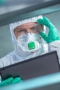 Virologist healthcare professional using tablet computer in laboratory Royalty Free Stock Photo