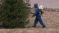 Virologist man in protective costume and respirator gas mask.