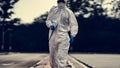 Virology scientists wear PPE kits to clean up