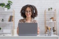 Virtual conference or meeting. Smiling african american woman has online conference on laptop