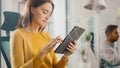 Virtual Connection Visualization Concept: Happy Young Woman Uses Digital Tablet Computer in the Royalty Free Stock Photo