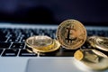 Virtual cryptocurrency concept. Golden bitcoins on the laptop touchpad closeup Royalty Free Stock Photo