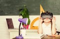 Virtual education. Child cute pupil wear hmd vr glasses. Studying in virtual reality. Modern technology. Interesting Royalty Free Stock Photo