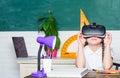 Virtual education. Child cute pupil wear hmd vr glasses. Studying in virtual reality. Modern technology. Interesting Royalty Free Stock Photo
