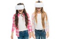 Virtual education. Kids wear hmd explore virtual or augmented reality. Future technology. Girls interact cyber reality Royalty Free Stock Photo