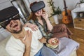 Couple in casual clothes wear the virtual reality glasses are watching and showing imagine via the VR camera