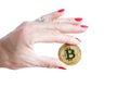 Virtual money golden bitcoin women hand with red nails fingers isolated on white background Royalty Free Stock Photo