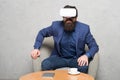 Virtual office and work space. Businessman sit chair wear hmd explore virtual reality or ar. Business partner interact