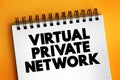 Virtual Private Network - encrypted connection over the Internet from a device to a network, text concept on notepad