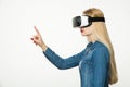 Virtual reality concept on white background. Woman wearing virtual reality goggles Royalty Free Stock Photo
