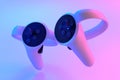Virtual reality controllers for online and home gaming in neon lights on white Royalty Free Stock Photo