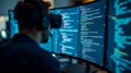 Virtual reality developer engaged in coding in a dimly lit office with multiple screens displaying complex programming Royalty Free Stock Photo