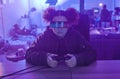 Virtual reality glasses, metaverse and woman gamer with controller for futuristic gaming in neon room. Person with ar
