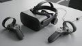 Virtual reality headset and black gaming controller on a dark surface Royalty Free Stock Photo