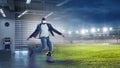 Virtual Reality headset on a black male playing soccer. Mixed media Royalty Free Stock Photo